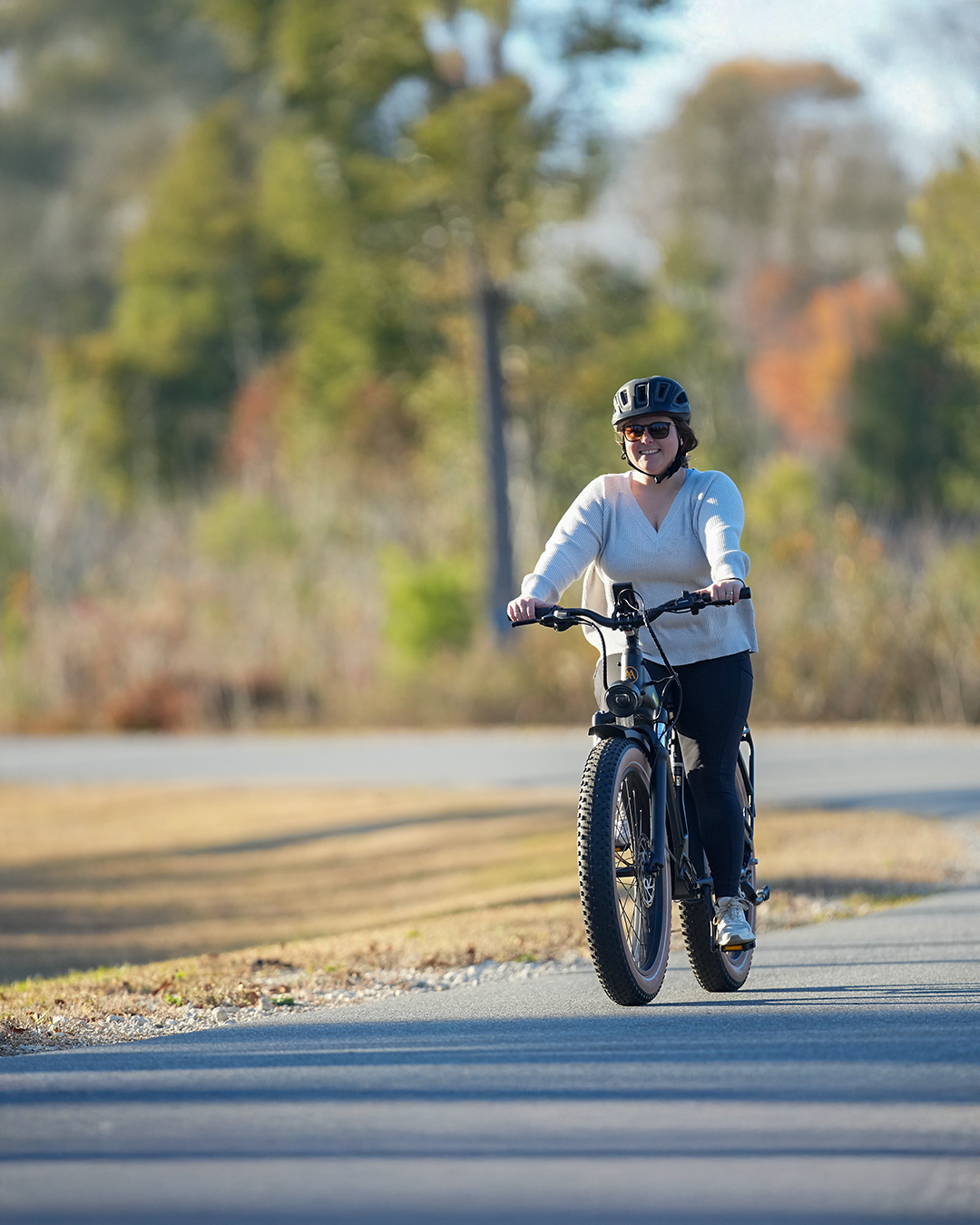 girl riding an e-bike rental through paved trails in Northern Florida at Florida Caverns State Park